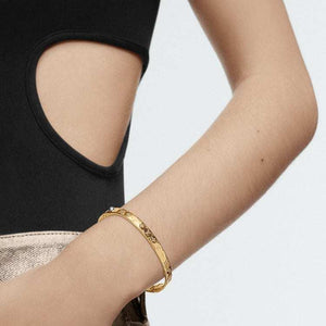 LOUIS VUITTON Logo engraved metal bracelet women's gold.