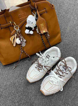 سنيكرز 530 أسفل الكاحل جلد نيو بالانس × ميو ميو New Balance X Miu Miu.