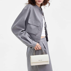 حقيبة Charles & Keith بمقبض علوي معدني وتصميم Crossbody.