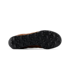 Bottom view of the sole and tread pattern on Donald Glover x New Balance RC30 cognac brown shoes.
