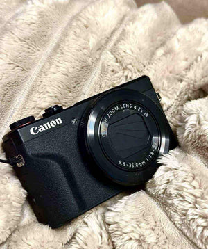 Back view of the Canon PowerShot G7 X Mark III with the touchscreen flipped up, ready for video content creation.