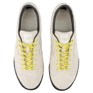 Donald Glover x New Balance RC30 low-top sneaker in hairy beige suede colorway, top-down perspective displaying textured suede uppers, speckled yellow lacing, light beige tongue branding, and dark interior collar padding.