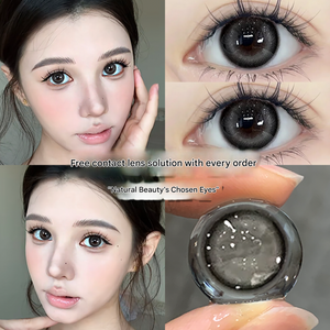 Young woman with large gray-toned contact lenses, natural makeup, soft skin, beauty shot