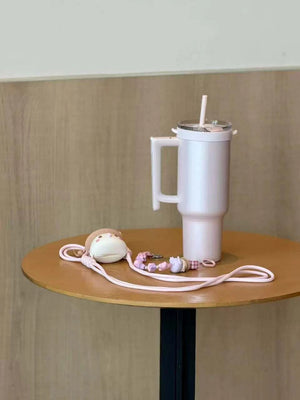 كوب Starbucks Tumbler وردي بمقبض وحزام للكتف.