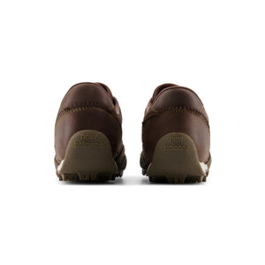Rear view of a pair of Donald Glover x New Balance RC30 "Golden Hour" brown shoes.
