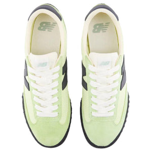 Top-down aerial view of a pair of light green and black New Balance RC30 shoes, displaying lime green suede toe caps and eyestays, pale green nylon vamps, white laces, off-white nylon tongues with light green NB logo tags, and cream-colored insoles with green printed branding.