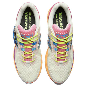 Top-down aerial view of a pair of multicolor Action Bronson x New Balance shoes 1906R model "Rosewater," displaying pale green mesh uppers, pink tongues with blue "Baklava" branding, neon yellow laces, blue N-Lock support eyelets, off-white padded collars, and dark insoles featuring neon green branding.