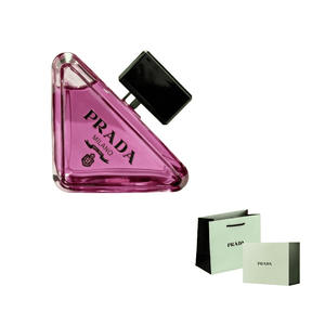 عطر برادا بارادوكس وتحته حقيبة وعلبة الهدايا