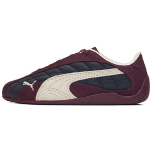 Puma Speedcat burgundy black white shoes inner side profile view on clean background.