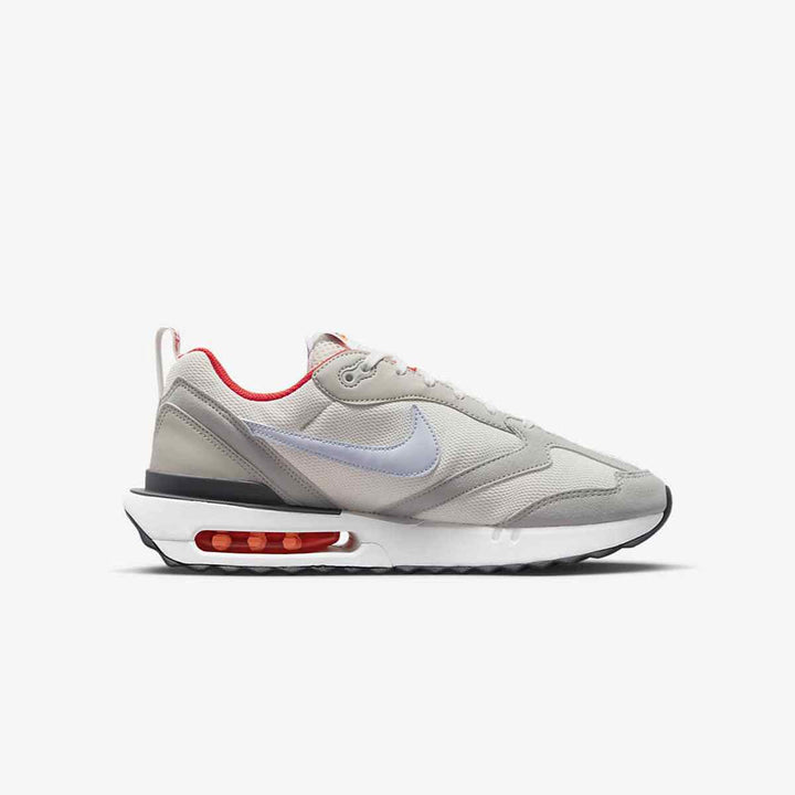 Nike Air Max Dawn sneakers with visible air cushion, high-quality leather and mesh materials, and stylish gray and white colors with red accents.