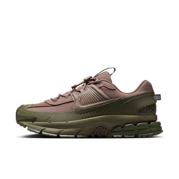 Nike Zoom Vomero sneaker in mink brown and medium olive with a thick midsole and rubber mudguard.