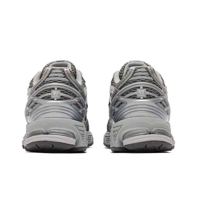 Rear view of New Balance 1906R metallic silver running shoes with breathable mesh and cushioned soles