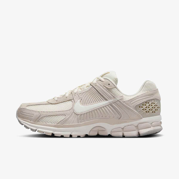 Nike Zoom Vomero 5 ivory sneaker with mesh leather and geometric details.