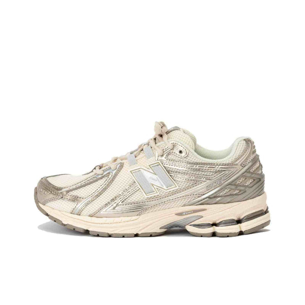New Balance 1906R beige sneaker with silver accents and breathable mesh upper for comfort and style