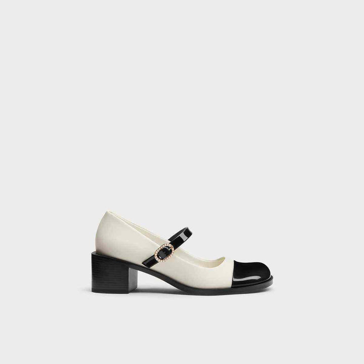 CHARLES&KEITH white and black Mary Jane heels with wide heel and embellished strap.