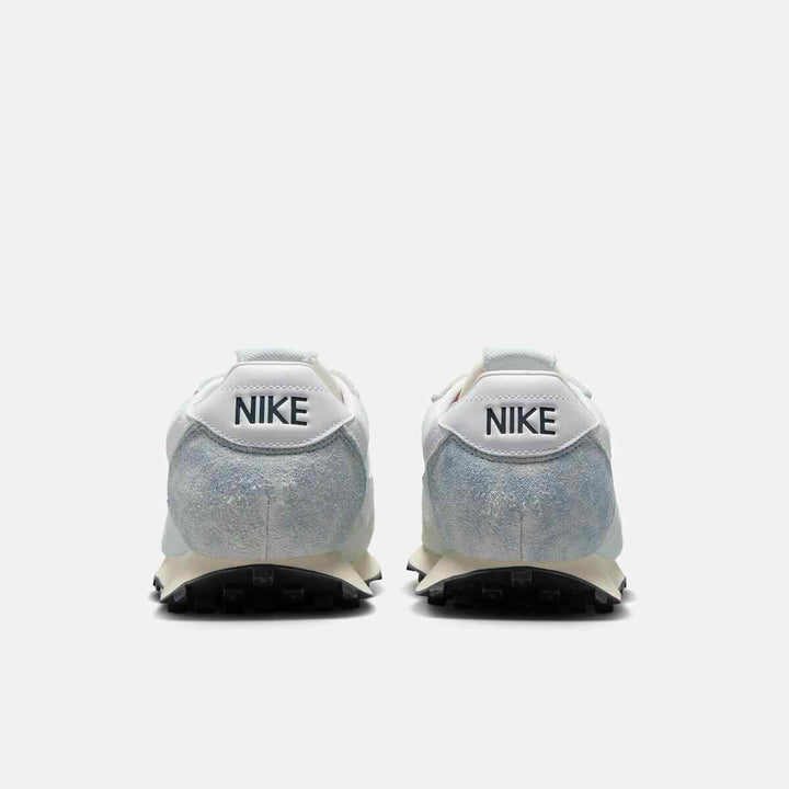 Nike نايكي LD-1000 sneakers in light blue and pearl white with wide heel, denim and leather upper, rubber waffle outsole, and foam midsole.