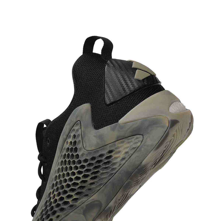 adidas | A.E. 1 stylish black sneaker with transparent camouflage details and durable sole.