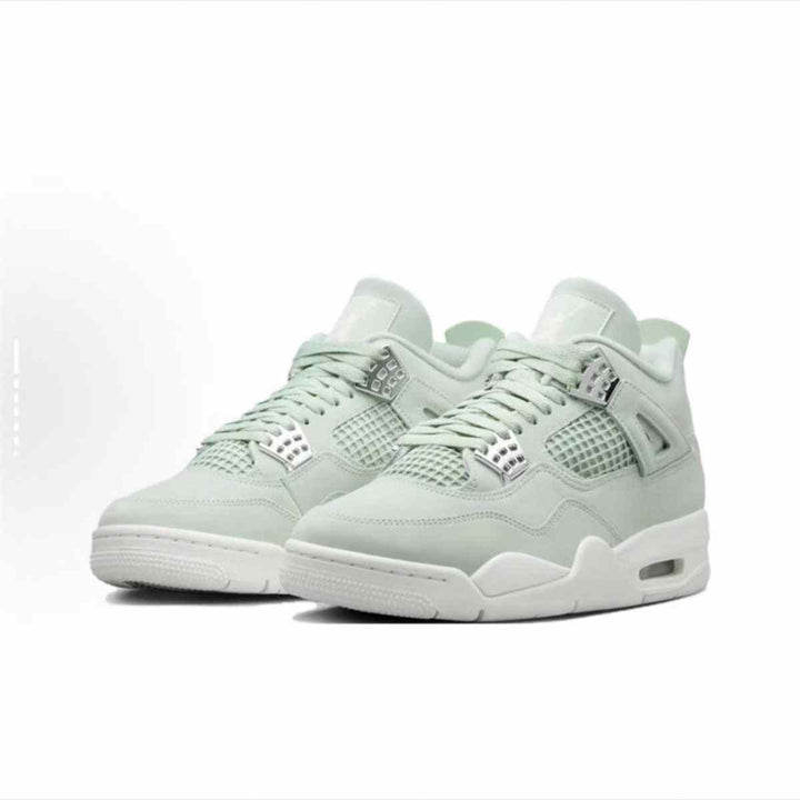 Air Jordan 4 Retro sneakers in light green Seafoam with metallic silver accents.