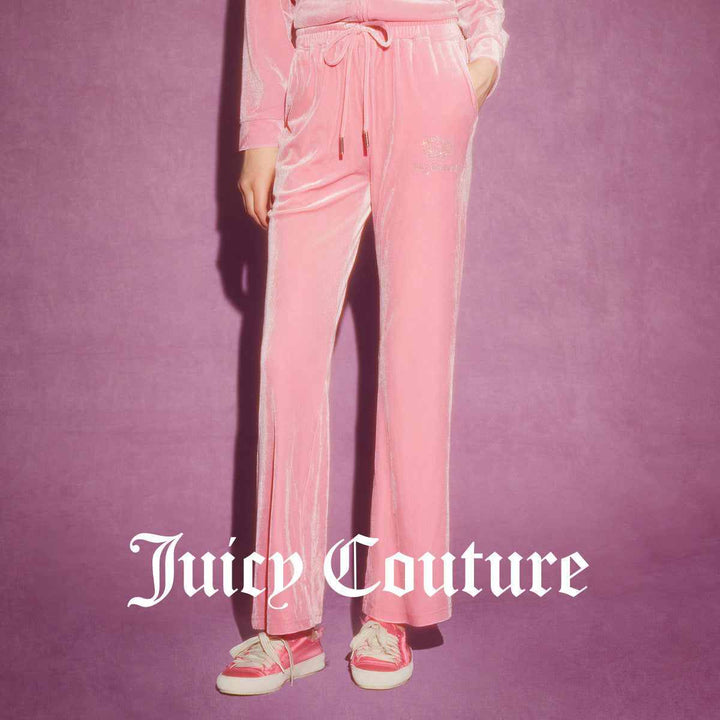 Juicy Couture pink velour pants with wide cut and embroidered logo.