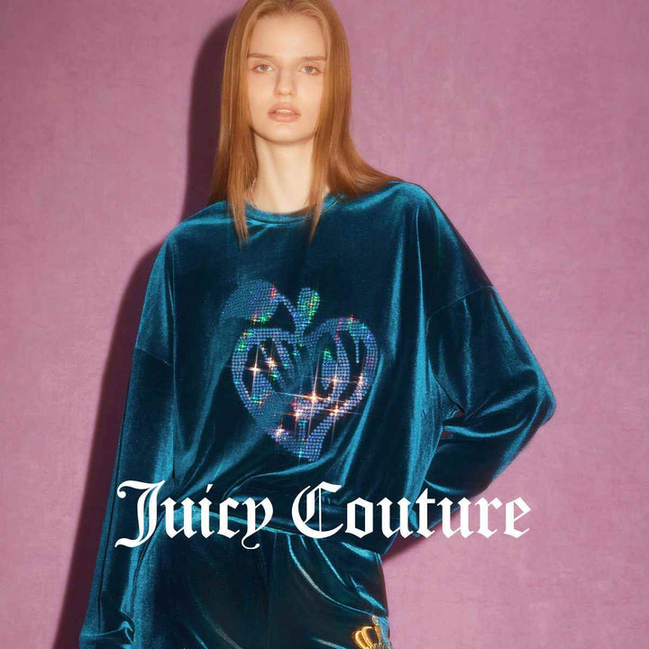 Juicy Couture blue velvet sweater with sparkling rhinestone heart design.