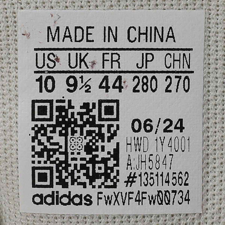 Barcode label for "adidas | حذاء أديداس الرياضي بتصميم عصري ولمسات كلاسيكية" showing size and manufacturing details.