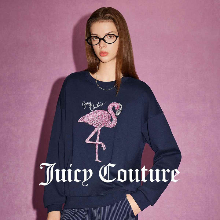 Juicy Couture navy sweatshirt with pink flamingo embroidery and logo.