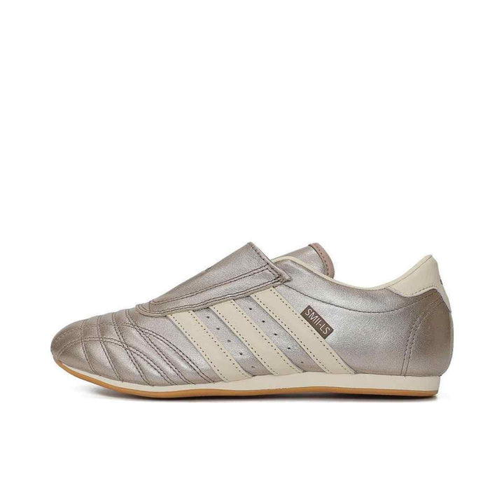 Adidas Clover luxurious slip-on sports shoe in metallic and cream design.