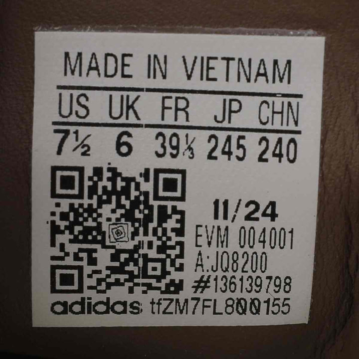 Size label on Adidas Clover luxury slip-on sneakers, showcasing international sizes and QR code.