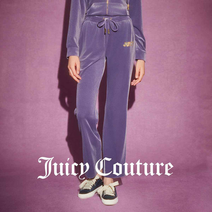 Juicy Couture purple velvet pants with wide cut and sparkly "JUICY" embroidery.