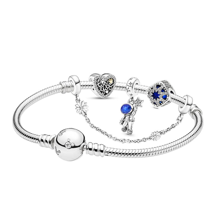 Elegant silver PANDORA bracelet adorned with frosty floral and sparkling blue details.