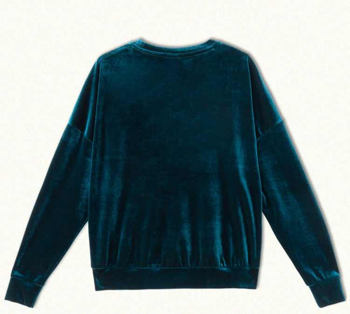 Juicy Couture royal blue velvet sweater with modern design and sparkling rhinestone details.