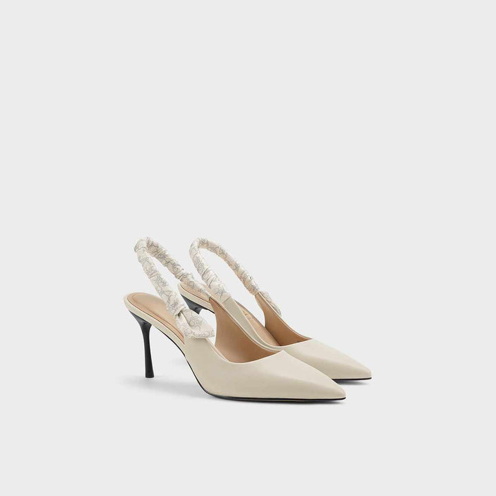 CHARLES&KEITH حذاء بكعب عالي بشرائط مطاطية منقوشة بلون كريمي أنيق.