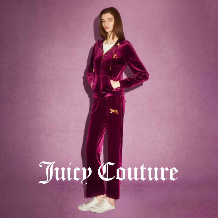 Juicy Couture velvet pants with classic wide design and golden button details.