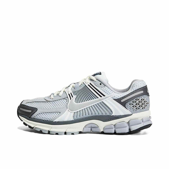 Nike Zoom Vomero 5 women's sneaker in gray with modern design, featuring breathable mesh and synthetic leather for comfort and style.