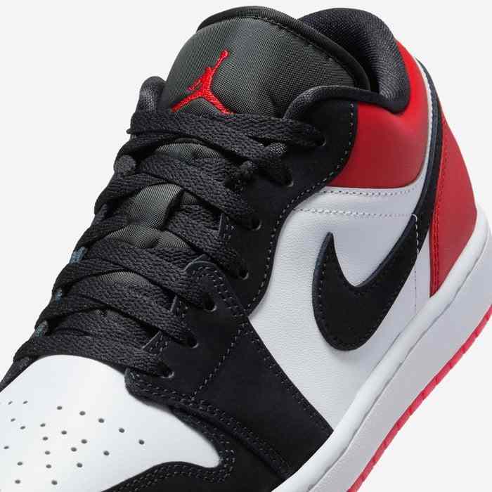 Air Jordan 1 Low men's shoe in white, varsity red, and black with classic design.