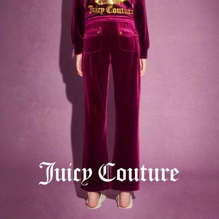 Juicy Couture velvet pants with gold buttons and elegant embroidery.