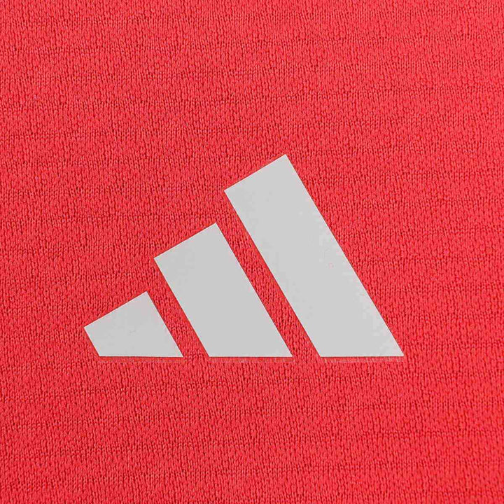 Red women's athleisure skirt with adidas logo, perfect for everyday fashion.