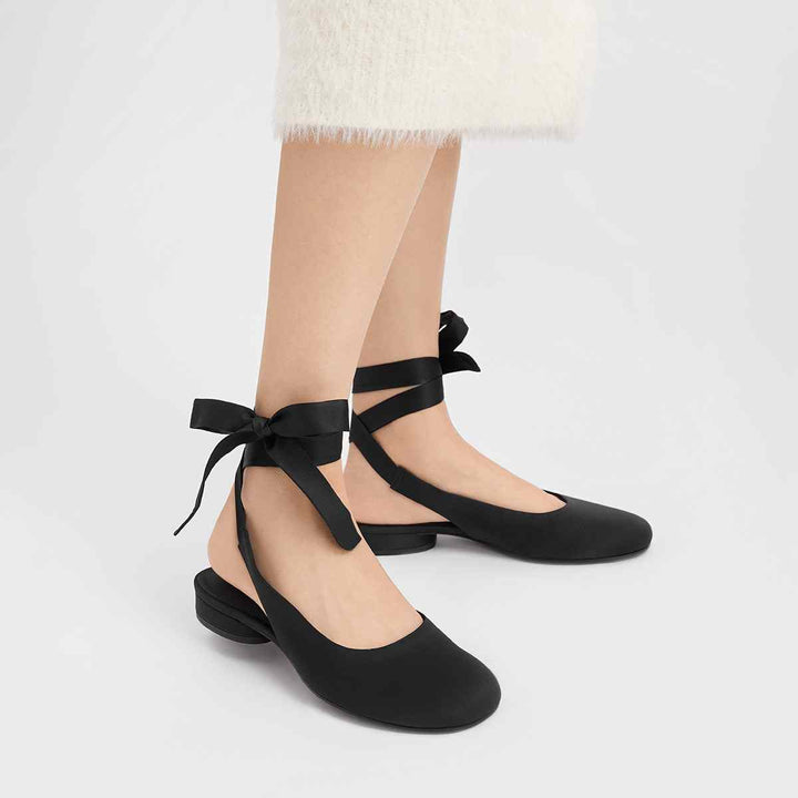 CHARLES&KEITH black satin lace flat shoes with round toe and ankle wrap design.