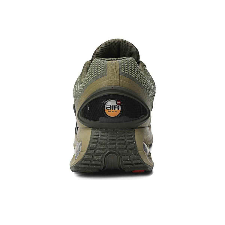 Olive green Nike Air Max DN with dynamic Air unit, featuring dual-pressure tubes for comfort and futuristic design.