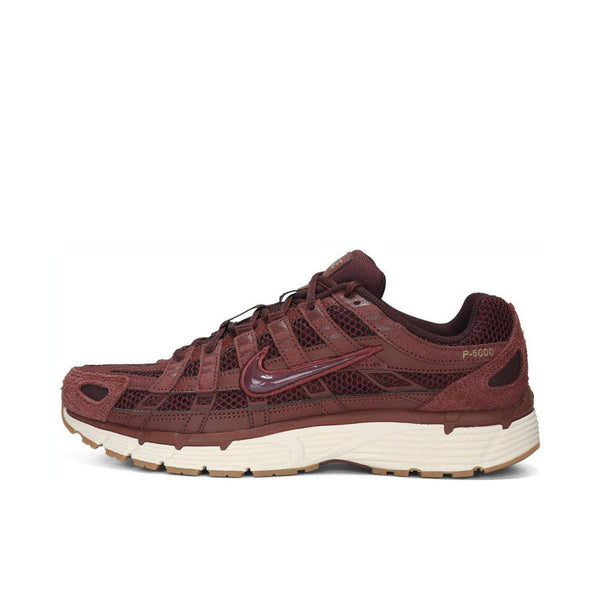 Nike P-6000 sneaker in burgundy with mesh and leather design, light brown rubber sole.