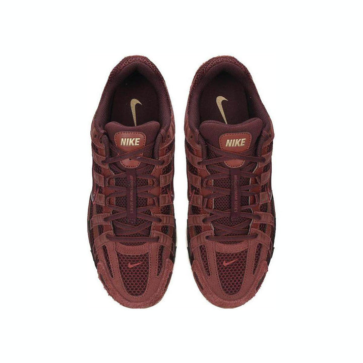 Nike P-6000 sneakers in burgundy with mesh and leather design.