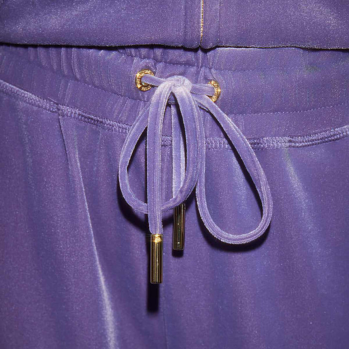 Juicy Couture velvet pants with adjustable drawstring in vibrant purple.