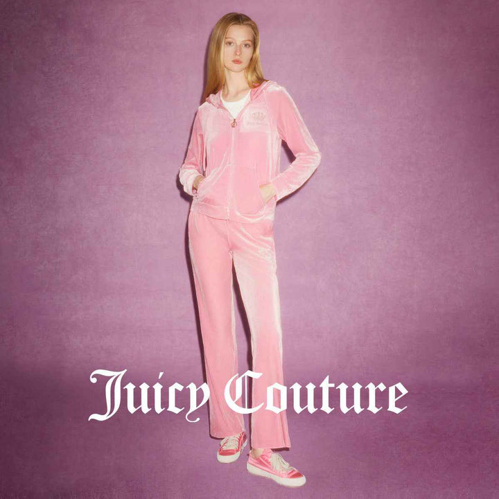 Juicy Couture pink velvet pants with logo embroidery and gold details.