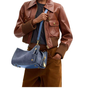 COACH Rogue 34 denim.
