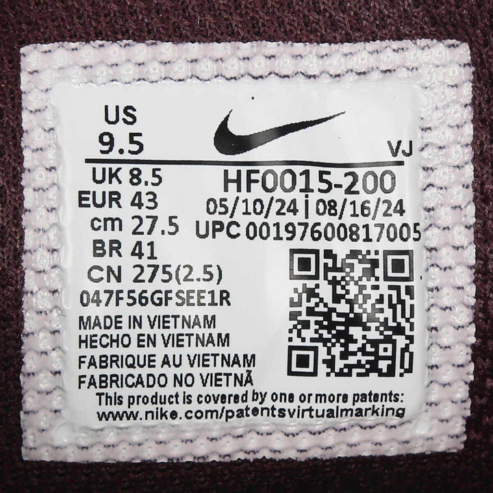 Nike P-6000 burgundy athletic shoe tag showing size and manufacturing details.