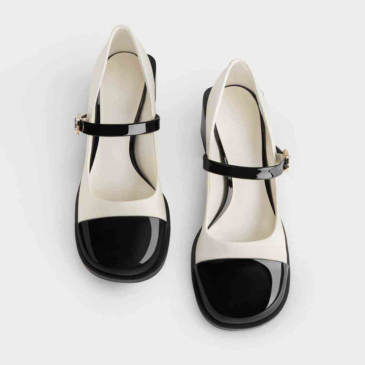 CHARLES&KEITH black and white Mary Jane shoes with wide heel and embellished strap.
