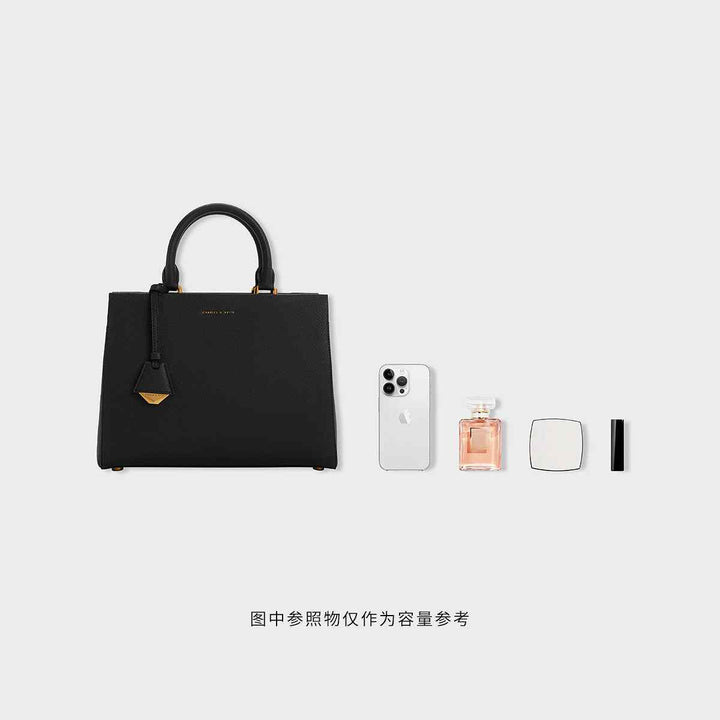CHARLES&KEITH Mirabel black top handle bag with gold accents, sustainable materials, and adjustable strap.