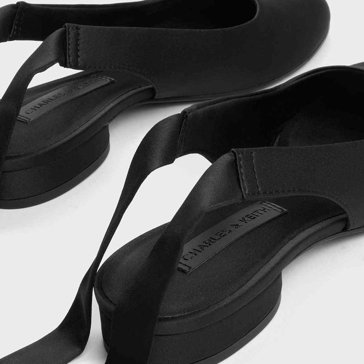 CHARLES&KEITH black satin-tie flat shoes with round toe.