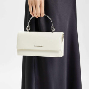 حقيبة Charles & Keith بمقبض علوي معدني وتصميم Crossbody.
