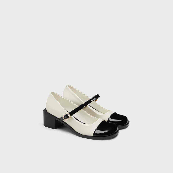 CHARLES&KEITH Mary Jane shoes in black and white with wide heel.